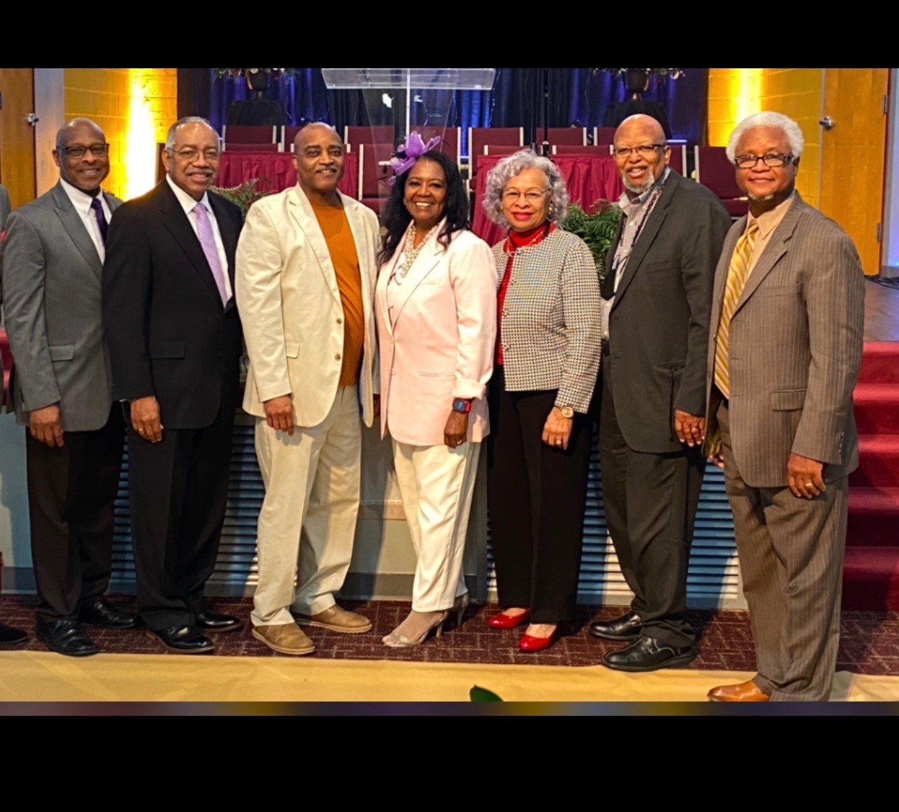 The elders of Community Evangelistic Church gathered in the sanctuary